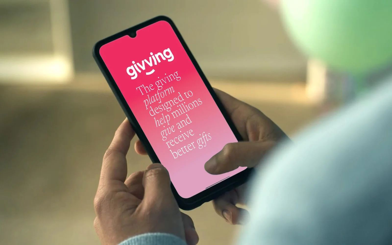 The Givving app in a customer's hands: the giving platform designed to help millions give and receive better gifts.